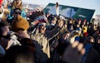 A crowd gathers in celebration at the Oceti Sakowin camp after it was announced that the U.S. Army Corps of Engineers won't grant easement for the Dak