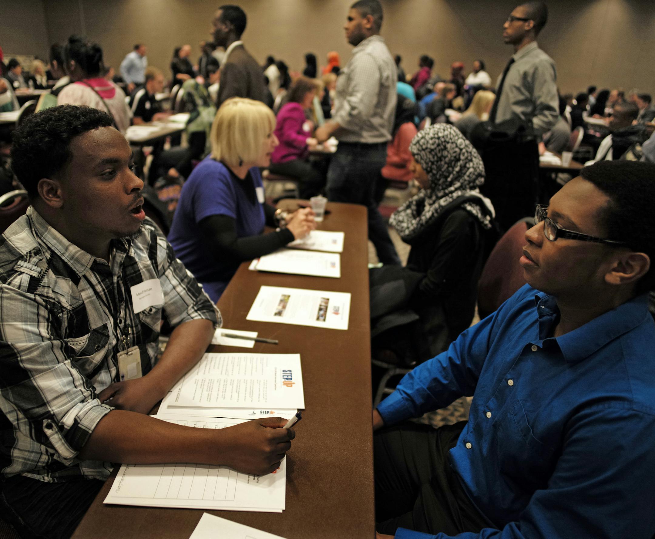 At the Minneapolis Convention Center where Step Up held mock interviews for kids 14 to 21, Maruf Hassan, a Step Up graduate, left, interviewed Hussein Mkomo, a Southwest H.S. student who hopes to get an internship in the corporate sector .]richard.tsong-taatarii/rtsong-taatarii@startribune.com