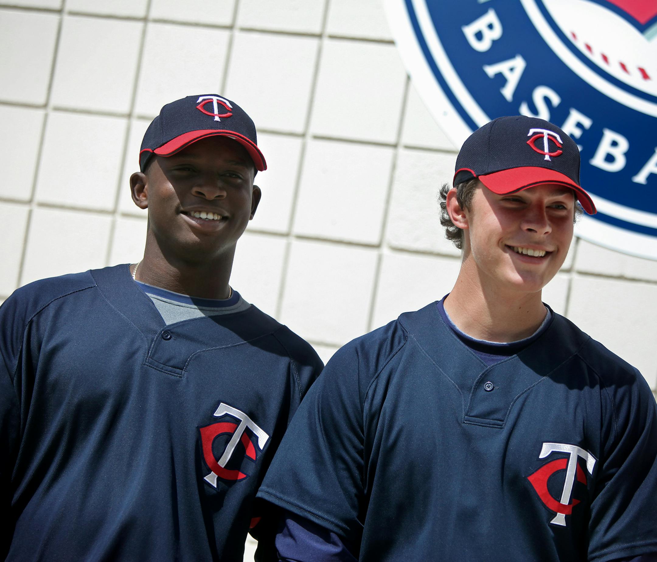 ELIZABETH FLORES • eflores@startribune.com March 3, 2010 -Fort Myers, FL IN THIS PHOTO: ] Minnesota Twins Miguel Angel Sano, a Dominican shortstop considered by many as the top free agent teenage prospect in Latin America, left, and Max Kepler were all smiles for the team's photographer during a recent shoot. ORG XMIT: MIN2016020813122024