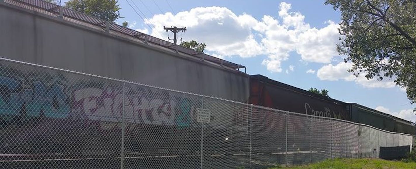 A new fence runs between tracks and Webber Park in north Minneapolis. ORG XMIT: AEqET4cqV4gNw6yNSmL7