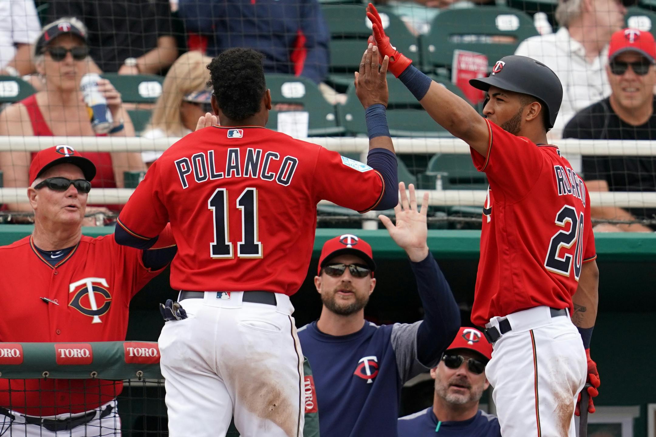 Minnesota Twins shortstop Jorge Polanco (11) was congratulated in the dugout after scoring during Monday's game against the Baltimore Orioles.