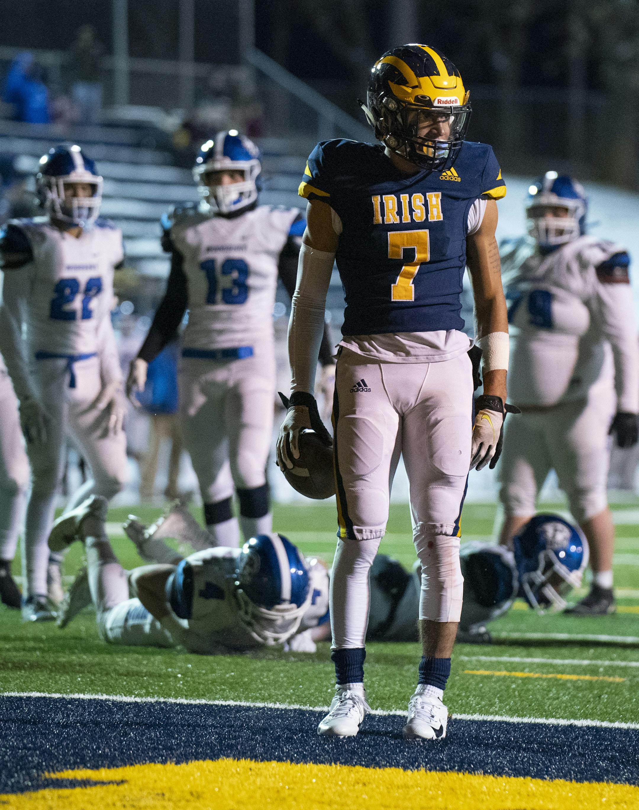 Rosemount's Christian Graske (7) paused after he walked into the end zone untouched after a seven yard run in the third quarter for what proved to be the winning touchdown. ] JEFF WHEELER • jeff.wheeler@startribune.com Rosemount defeated Woodbury 9-7 in a hastily scheduled makeup game Monday night at Irish Stadium after a COVID-related postponement. They played at Rosemount on a chilly Monday night, October 26, 2020.