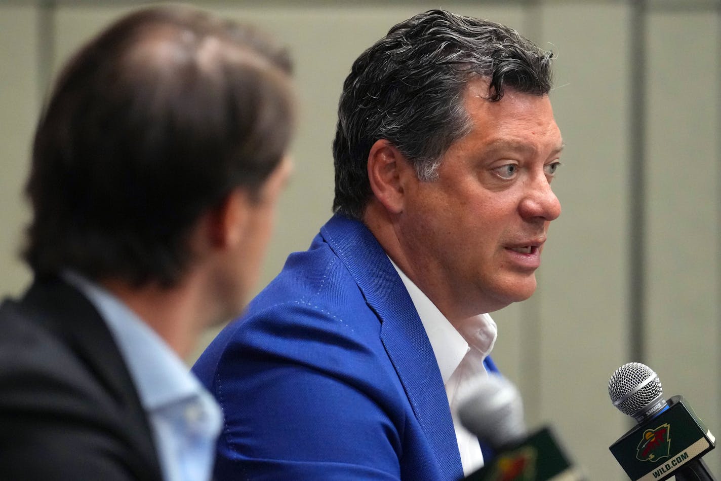 Minnesota Wild general manager Bill Guerin takes questions as he sits with newly named AHL affiliate Iowa Wild head coach Brett McLean during a press conference to announce his hiring Tuesday, May 30, 2023 at RiverCentre in Saint Paul, Minn. ] ANTHONY SOUFFLE • anthony.souffle@startribune.com