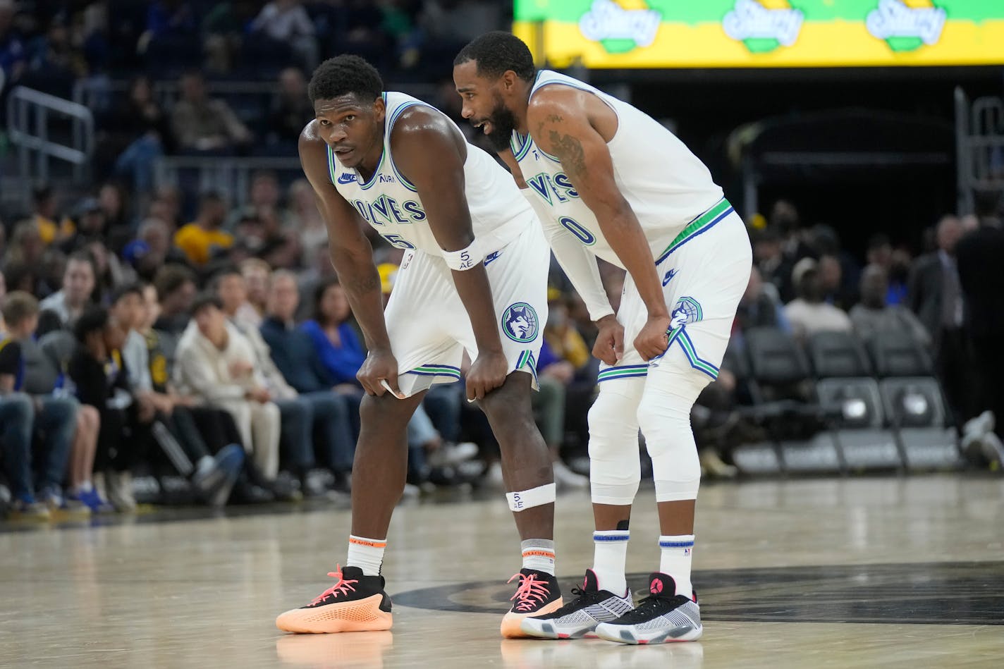 Minnesota Timberwolves guards Anthony Edwards, left, and Mike Conley during an NBA basketball game against the Golden State Warriors in San Francisco, Sunday, Nov. 12, 2023. (AP Photo/Jeff Chiu)