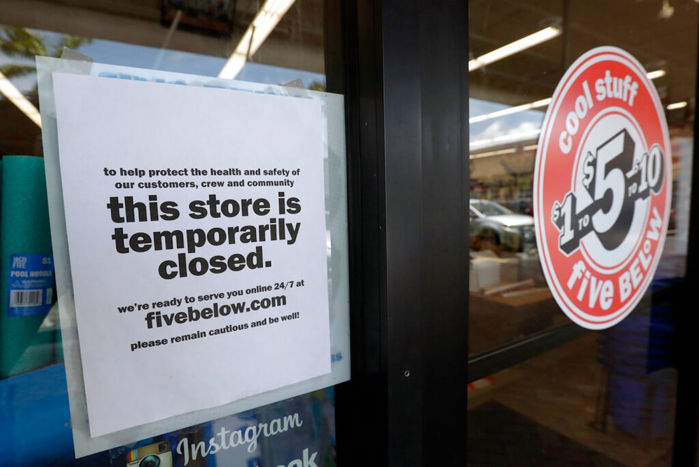 A sign on a closed store in North Miami, Fla.