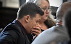 Kyle Rittenhouse puts his hand over his face as he is found not guilty on all counts at the Kenosha County Courthouse on Nov. 19.