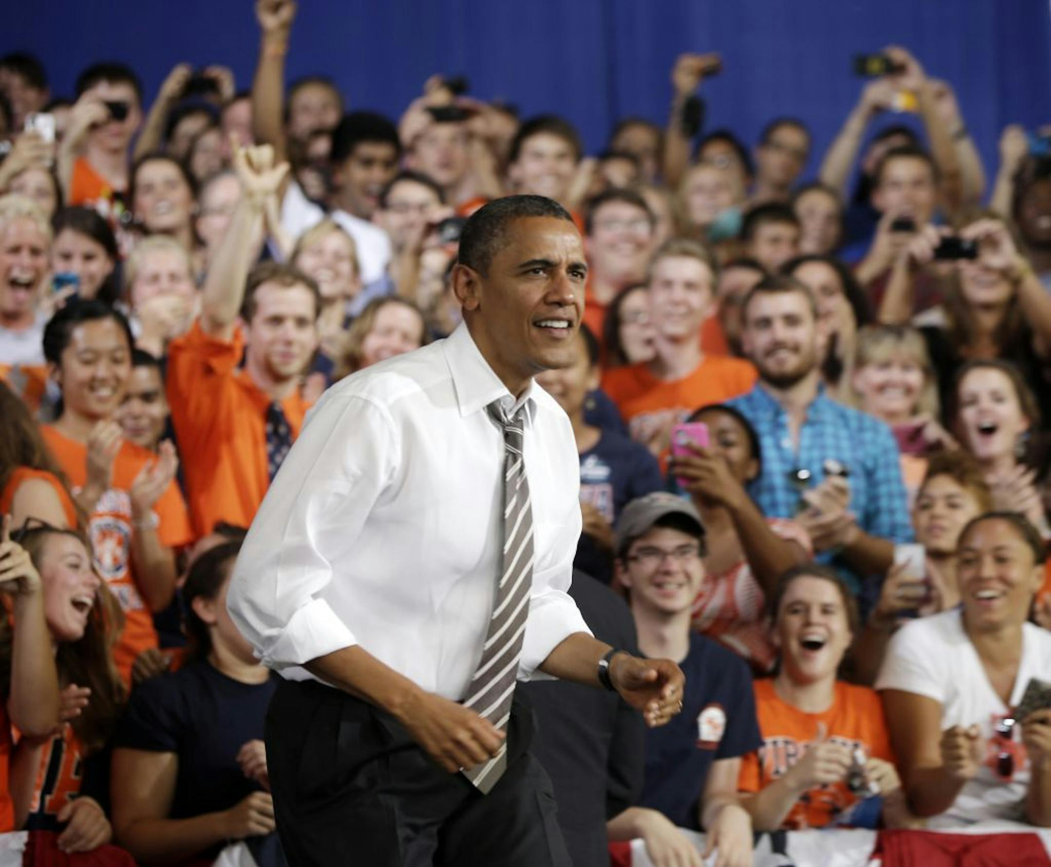 President Barack Obama takes the stage to speaks at a campaign event, Wednesday, Aug. 29, 2012, in Charlottesville, Va.