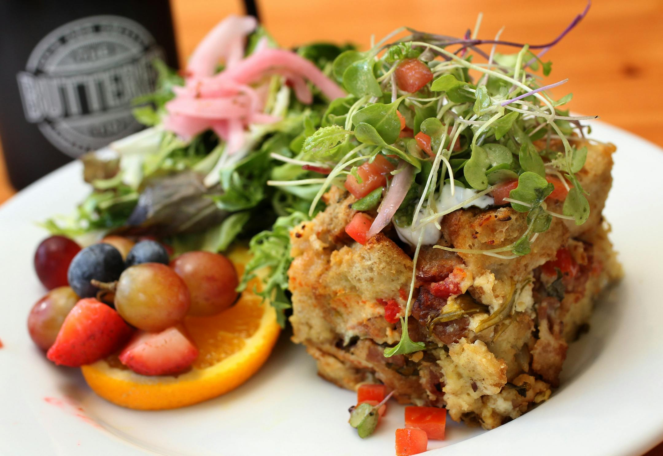 The breakfast "hot dish." ] STAR TRIBUNE/TOM WALLACE Assignments #20029971A July 19, 2013 SLUG & MAGIC SAXO#: 490032 rn072513 EXTRA INFO: Two new St. Paul bakery/cafes. The Buttered Tin, co-owners Jennifer Lueck and Alicia Hinze, and the Food: French toast, breakfast "hot dish," tomato soup, chicken club sandwich, Twinkies and HoHo pastries, and a sliced sweet breads on the counter. ORG XMIT: MIN1307212051380880