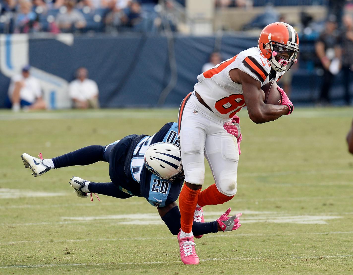 Cleveland Browns wide receiver Ricardo Louis (80) tries to get past Tennessee Titans cornerback Perrish Cox (20) in the second half of an NFL football game Sunday, Oct. 16, 2016, in Nashville, Tenn. (AP Photo/Mark Zaleski)