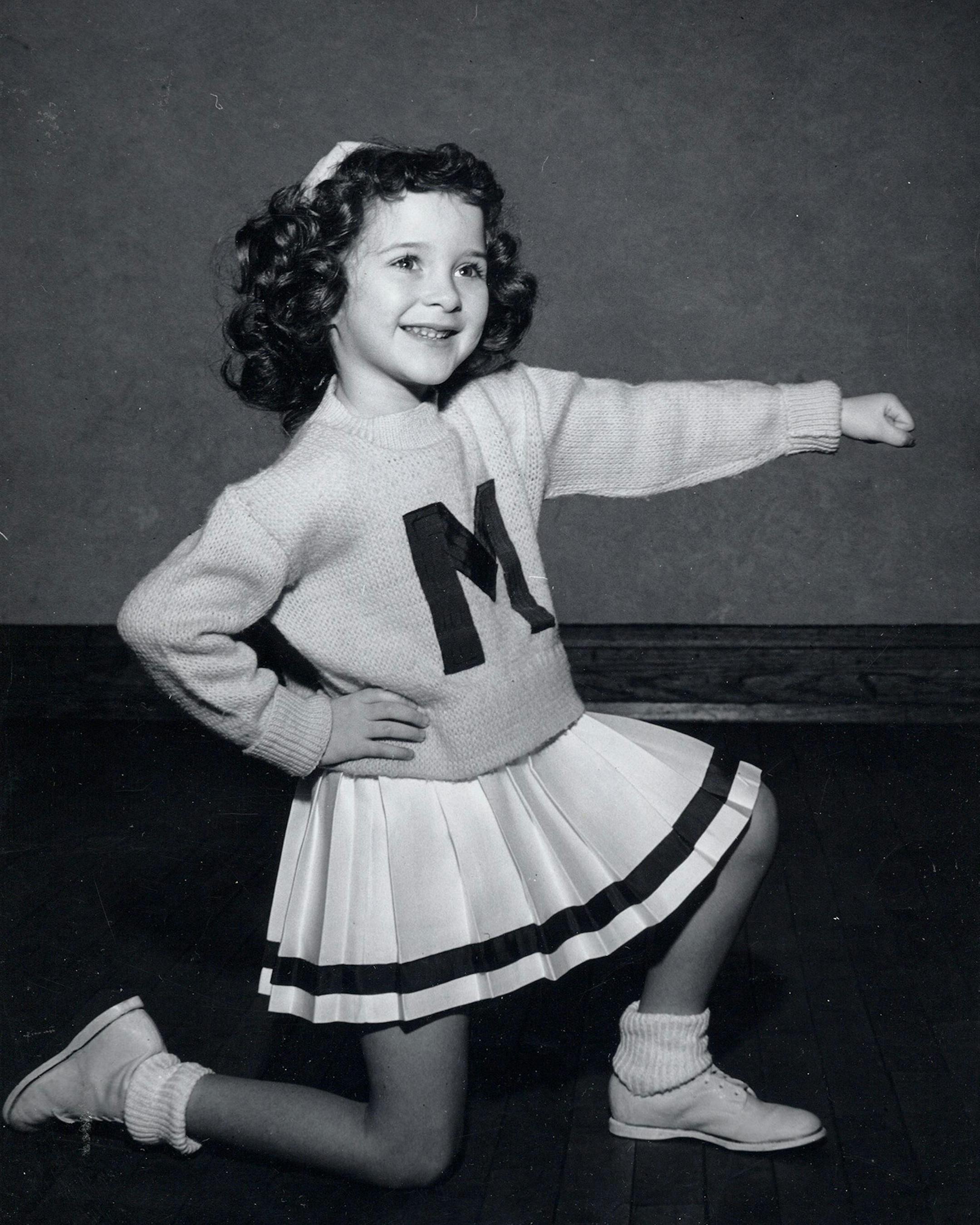 Mary Beth Sartor Obermeyer, Minneapolis
Over 70 years ago, I was the cheerleading mascot at the North Iowa-South Minnesota Cheerleading Clinic. At age 4, cheering, and on the floor of the clinic, leading a cheer.