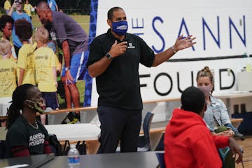 Tony Sanneh spoke to Dreamline mentors during a training session at the Sanneh Foundation headquarters.