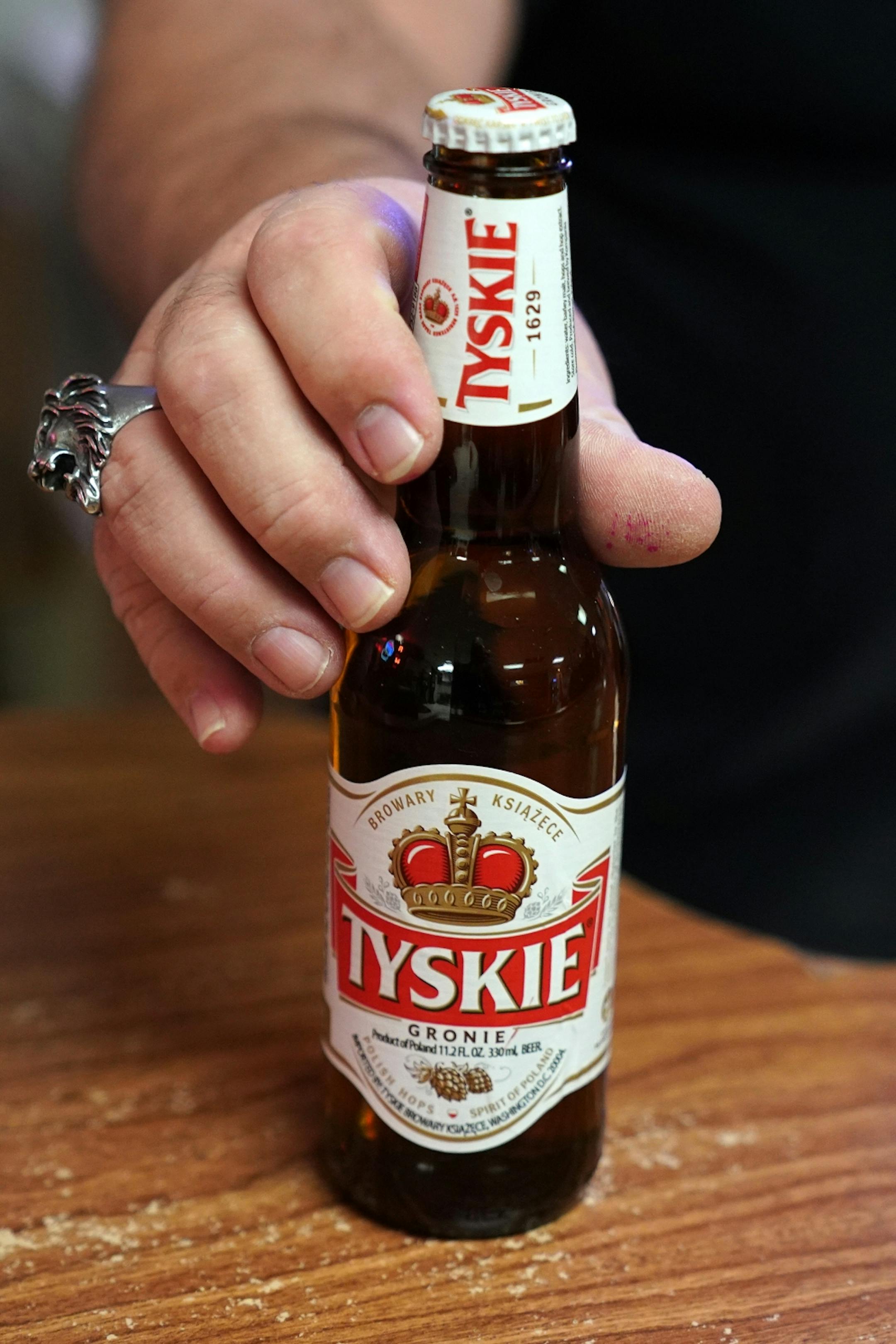 Bartender and and the National Polish Alliance outpost president Lonnie Finke showed off one of their Polish beers during a quiet Thursday night.