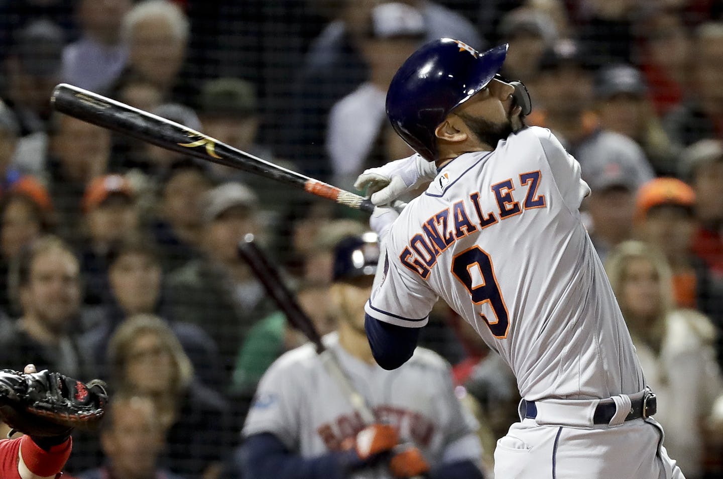 Houston Astros' Marwin Gonzalez watches his two-run home run against the Boston Red Sox during the third inning in Game 2 of a baseball American League Championship Series on Sunday, Oct. 14, 2018, in Boston. (AP Photo/David J. Phillip)