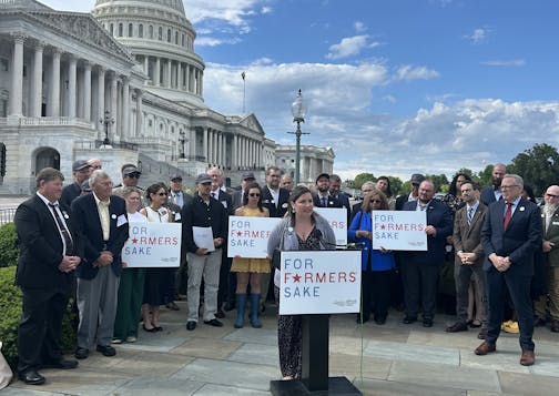 Anne Schwagerl, a soybean farmer from Big Stone County in Minnesota, speaks at a rally seeking passage of the farm bill at the Capitol this week.