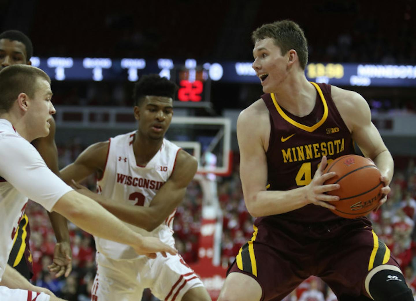 Feb 19, 2018; Madison, WI, USA; Minnesota Golden Gophers forward Michael Hurt (42) looks to pass as Wisconsin Badgers guard Brad Davison (left) and forward Aleem Ford (2) defend at the Kohl Center. Mandatory Credit: Mary Langenfeld-USA TODAY Sports