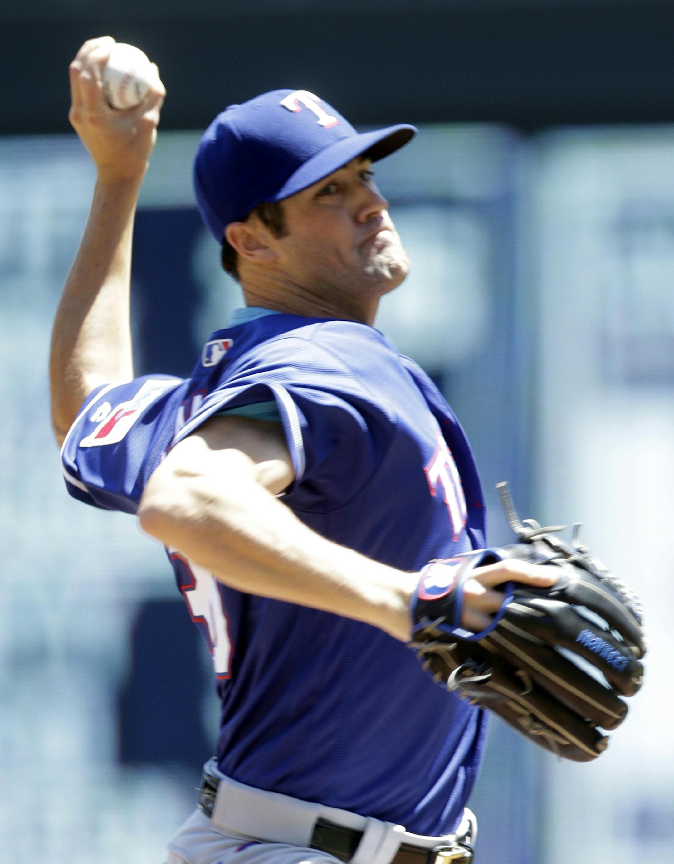 Texas Rangers pitcher Cole Hamels throws against the Minnesota Twins in the first inning of a baseball game Sunday, July 3, 2016, in Minneapolis. (AP Photo/Jim Mone)