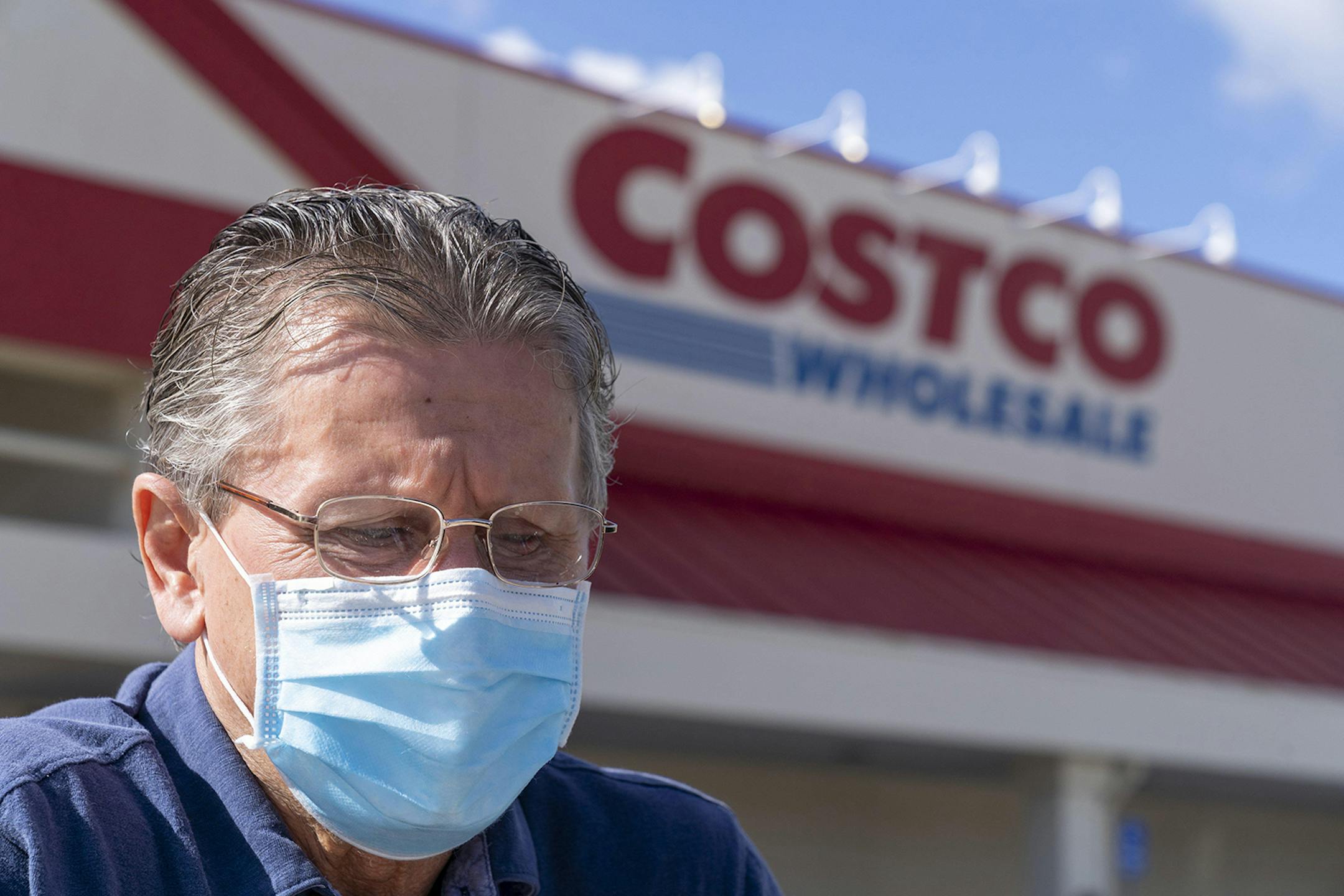 Dobro Hajek, of Jupiter, wears a masks as he pushes his grocery cart to his car at a Costco store in Palm Beach Gardens, on Friday, March, 13. (GREG LOVETT/Palm Beach Post/TNS) ORG XMIT: 1648953 ORG XMIT: MIN2004291354050063