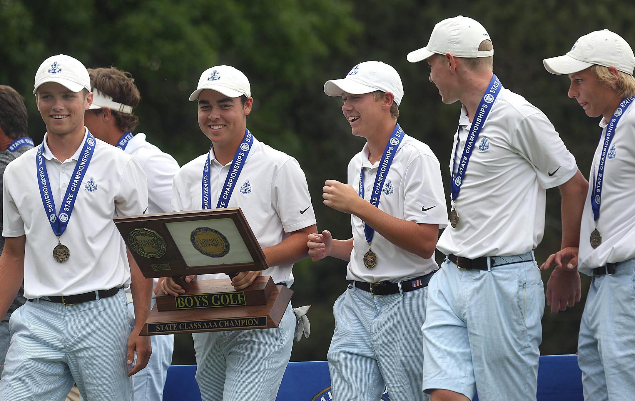 Minnetonka won the team championship, and Ben Sigel (holding trophy) was the winner of this year's Class 3A boys' golf tournament. (Jim Gehrz/Star Tribune)