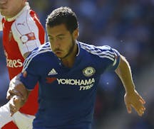 Arsenal's Hector Bellerin, left, vies for the ball with Chelsea's Eden Hazard during the English Community Shield soccer match between Arsenal and Che