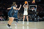 Iowa guard Caitlin Clark pulls up for a three-pointer — which she missed — over Penn State's Moriah Murray during the first quarter Friday in the 