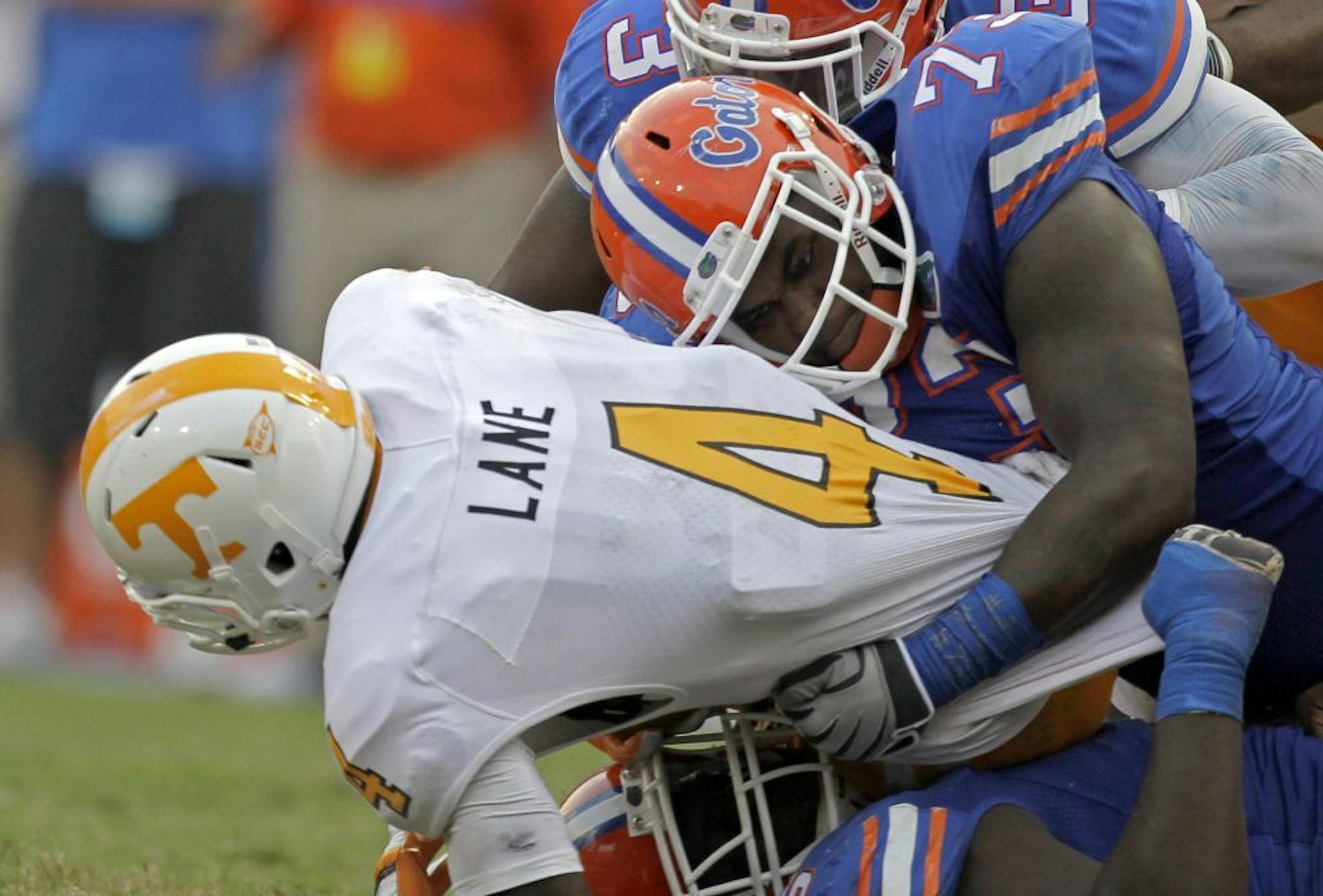 FILE - In this Sept. 17, 2011 file photo, Florida defensive tackle Sharrif Floyd (73), right, tackles Tennessee running back Marlin Lane (4) during the second half of an NCAA college football game in Gainesville, Fla. Floyd is considered a possible first round pick in the NFL Draft on Thursday, April 25, 2013.
