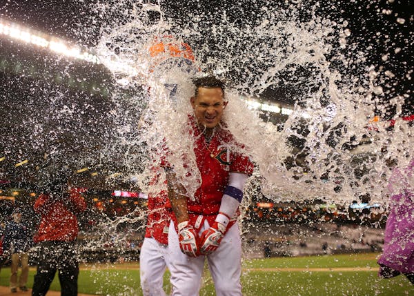 The Twins' Oswaldo Arcia received a Gatorade shower just before a postgame interview after his walk-off home run in the ninth inning beat Cleveland 4-