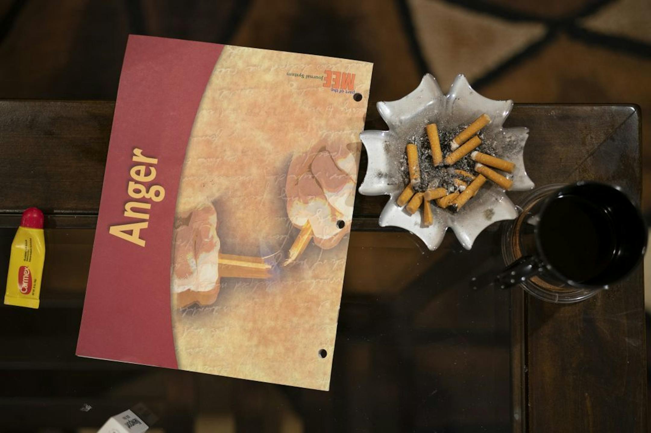 A workbook belonging to Anthony rested on the coffee table in his Robbinsdale home after he went over some fo the work he'd done in it with ISR Agent Ricardo Defiel Monday night.