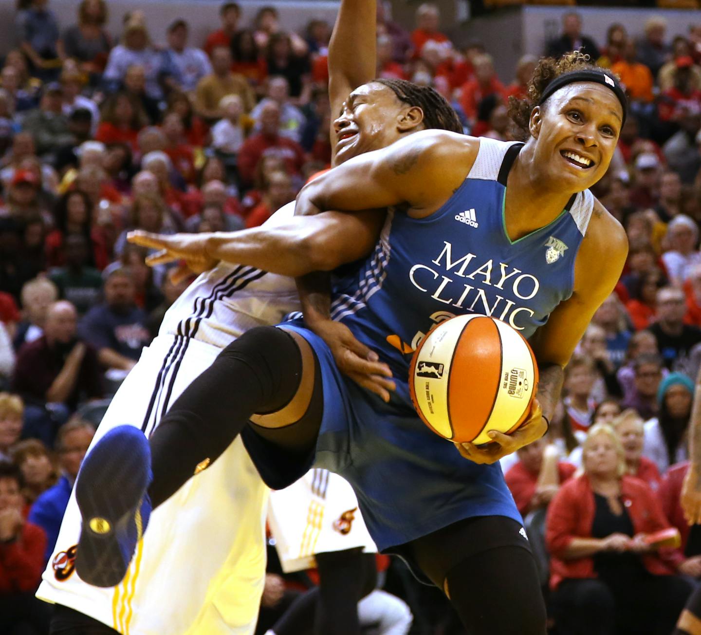 Minnesota Lynx forward Rebekkah Brunson (32) gets tangled up and fouled by Indiana Fever forward Tamika Catchings (24) while going for a rebound during game three of the WNBA Finals at Bankers Life Field House in Indianapolis on Friday, October 9, 2015. ] KYNDELL HARKNESS kyndell.harkness@startribune.com