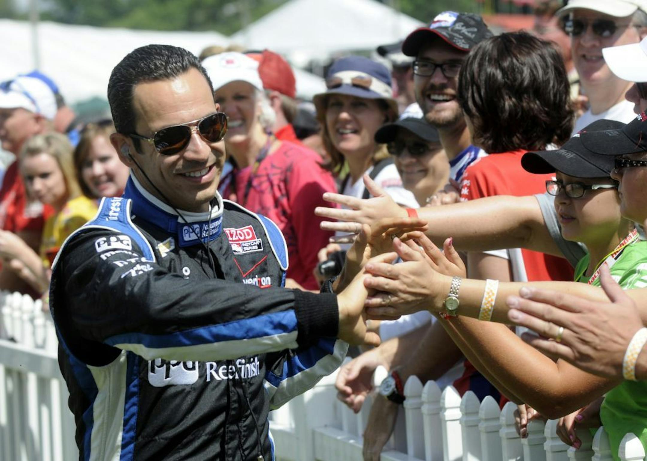 Helio Castroneves, of Brazil, is seen during driver introductions at the Honda Indy 200 at Mid-Ohio in Lexington, OH Sunday, Aug. 4, 2013.