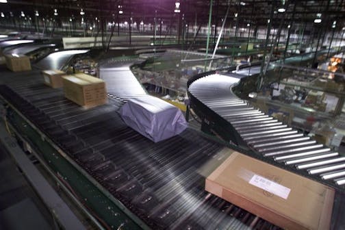 St. Cloud, MN., 11/29/99. After orders are filled and boxed, they travel down conveyor belts and then laser scanned and routed via overhead tracks to waiting trailer trucks The assembly and shipping area at St. Cloud Fingerhut�s warehouse/distribution center covers over 100,000 square feet and is where the boxes are filled with orders for shipping. Sunday Business Cover story about customer service on the Web. Fingerhut has a 1 million square foot warehouse/distribution center in St. Cloud that