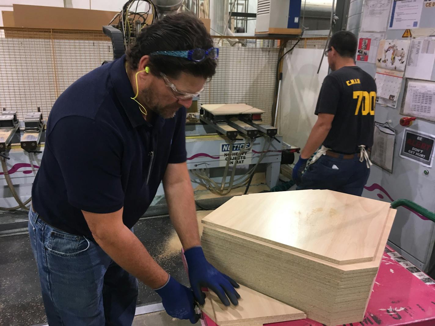 Waconia High School teacher David Aeling works on a wood cabinet at ELKAY &#xf1; Medallion Cabinetry plant in Waconia. The teacher is taking part in a teacher workforce initiative in partnership with the Waconia Chamber of Commerce and the Minnesota Chamber of Commerce&#xed;s Business Education Networks.