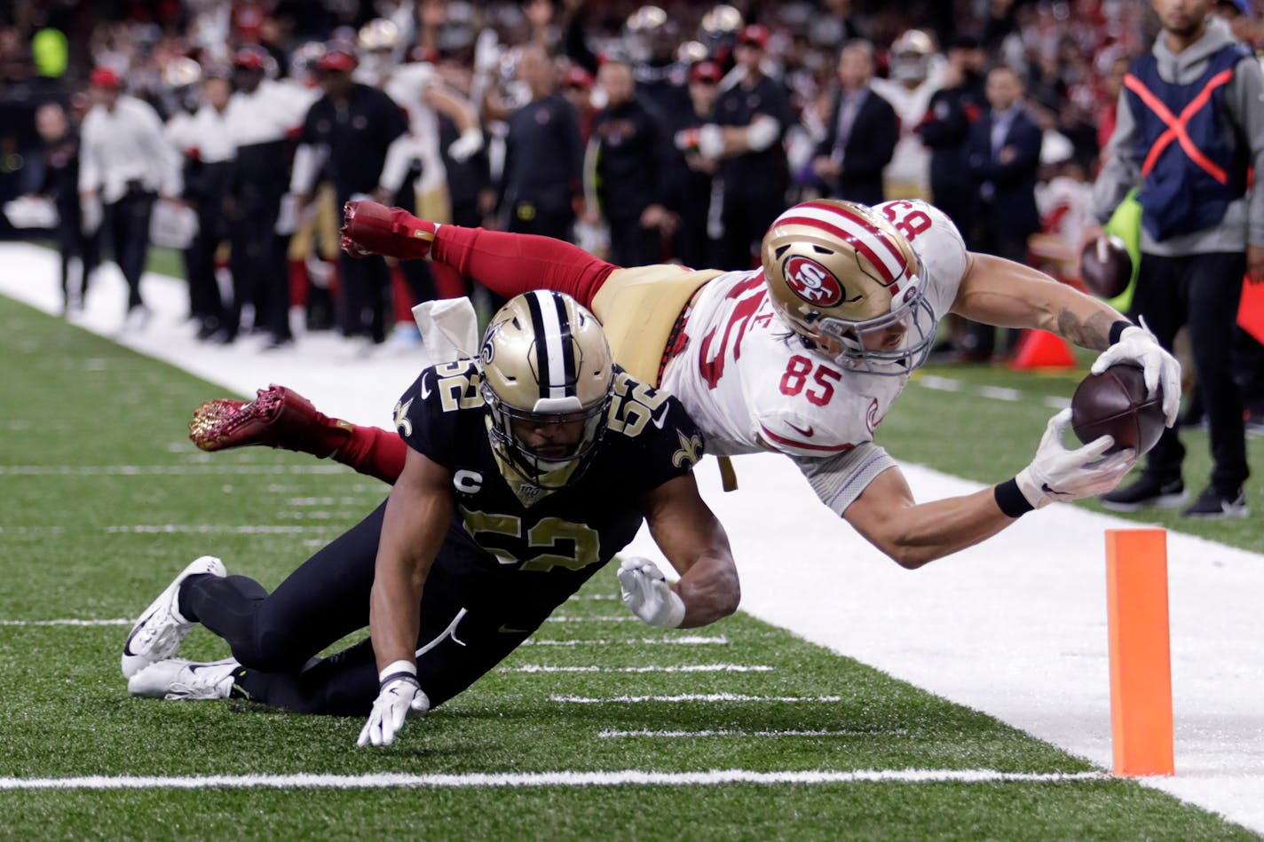 San Francisco 49ers tight end George Kittle dives to the pylon for a touchdown against New Orleans last month.