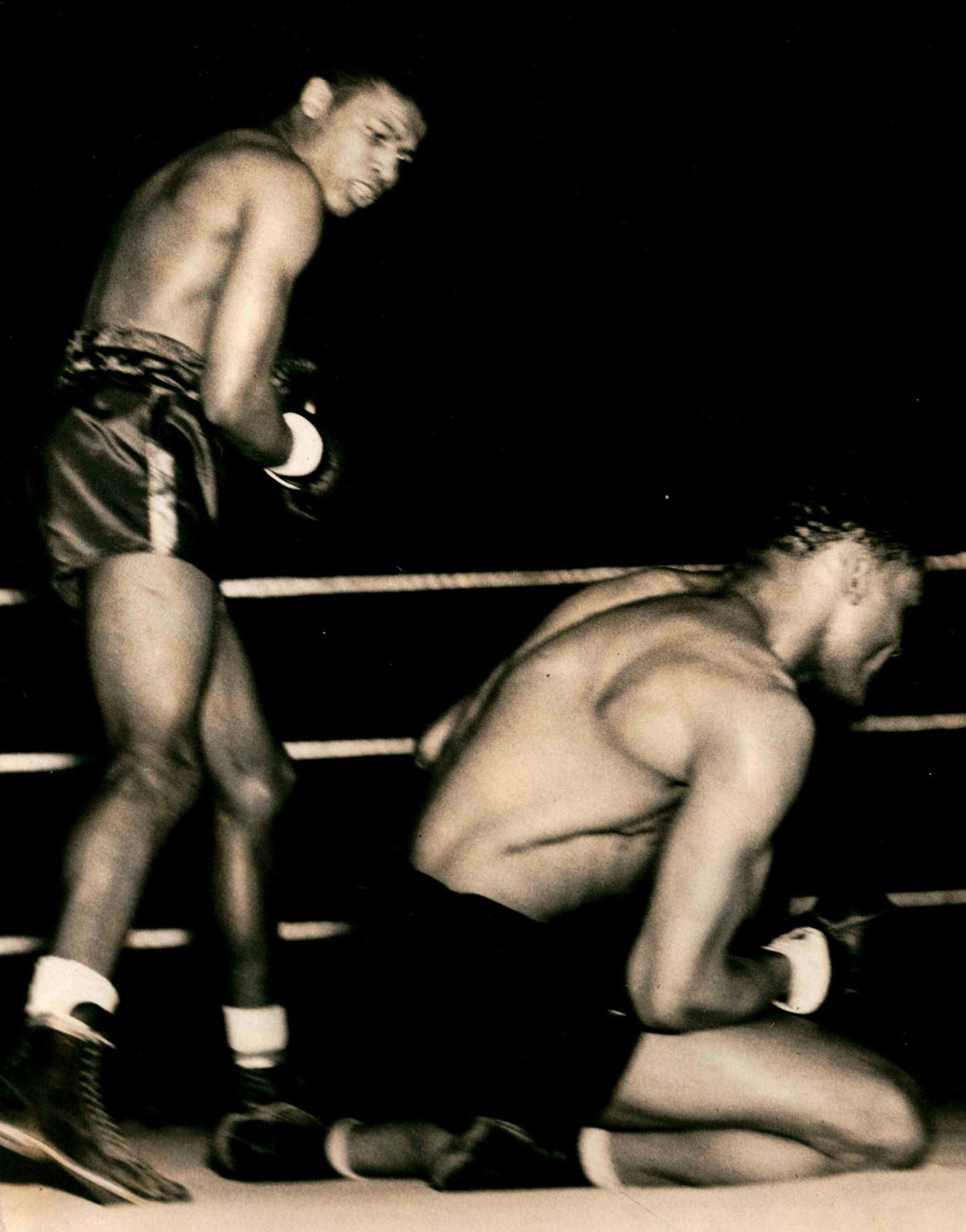 Sugar Ray Robinson (left) knocks down Dick Banner in the second round of their fight on April 4, 1941. This fight was held in the Minneapolis Armory.