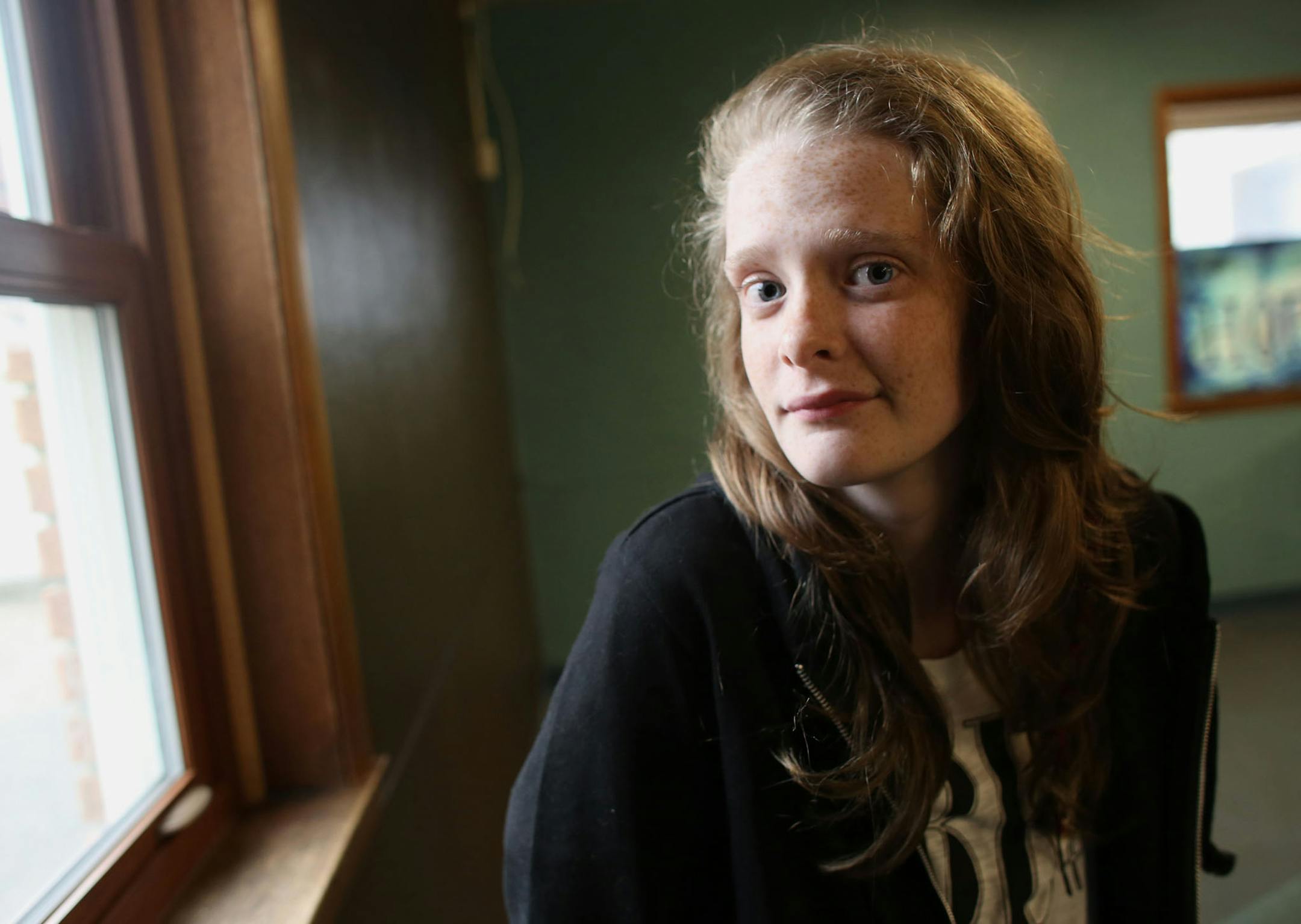 Ivy Griffiths, 16, sat by the window in the newly moved teen center at the Elim Baptist Church in Anoka Min., Thursday, October 3, 2013 Griffths, a junior at Champlin Park High School was a victim of cyberbullying. She feels the most safe among her friends at church. ] (KYNDELL HARKNESS/STAR TRIBUNE) kyndell.harkness@startribune.com ORG XMIT: MIN1310040912420533
