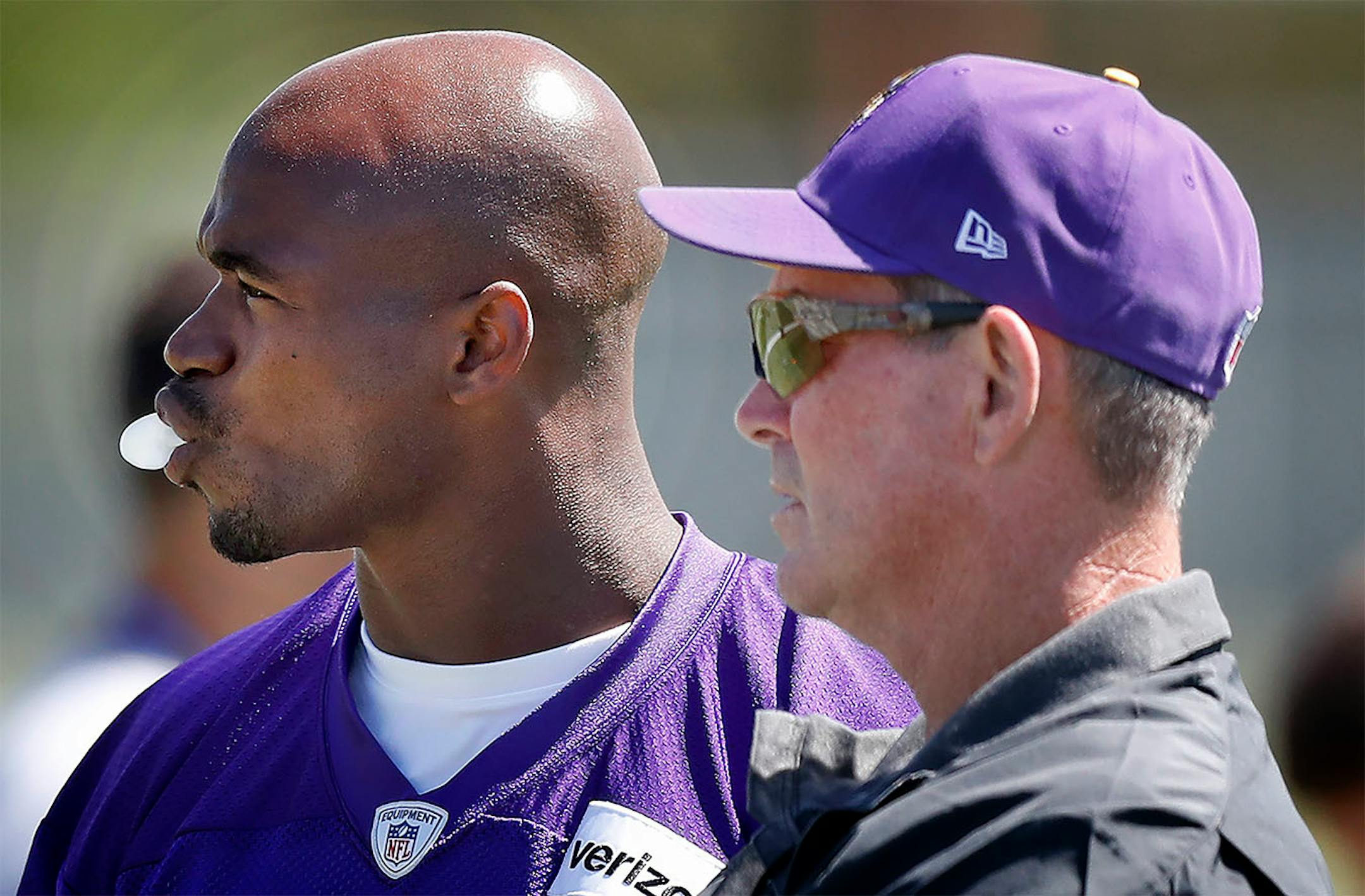 Adrian Peterson (28) and head coach Mike Zimmer during the afternoon practice on the first day of Vikings training camp in Mankato.