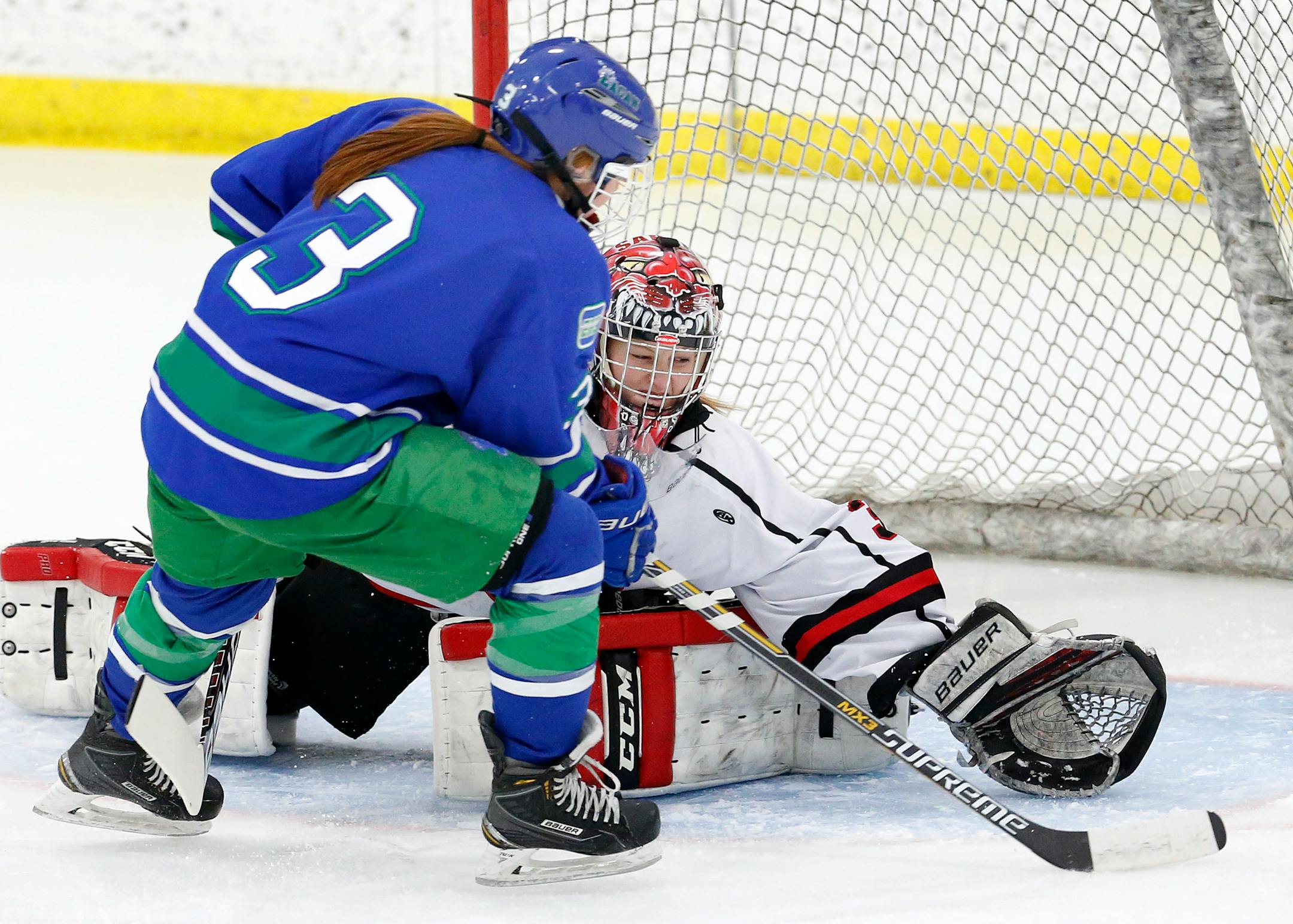 Brooke Madsen (3) of Eagan shot the puck past Shakopee goalie Kalli Engen (33) for a goal in the first period. (Carlos Gonzalez, Star Tribune)