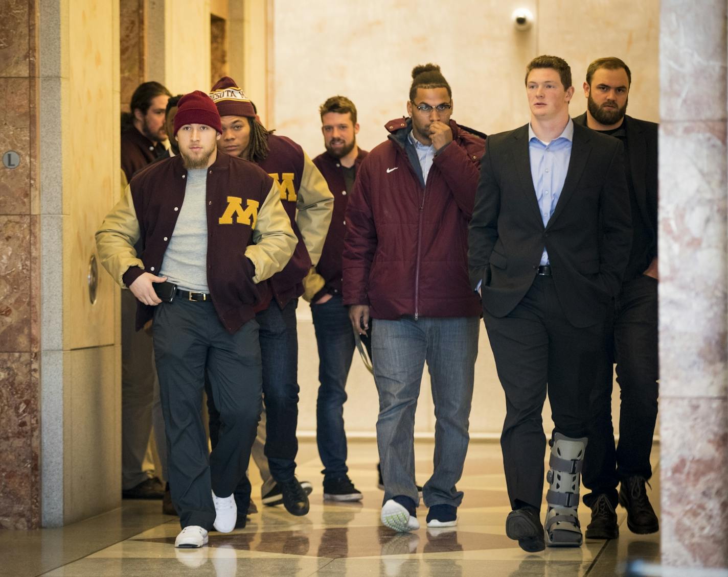 Gophers football players, none that have been suspended from the team, walked out of a lawyer's office in downtown Minneapolis on Friday morning.