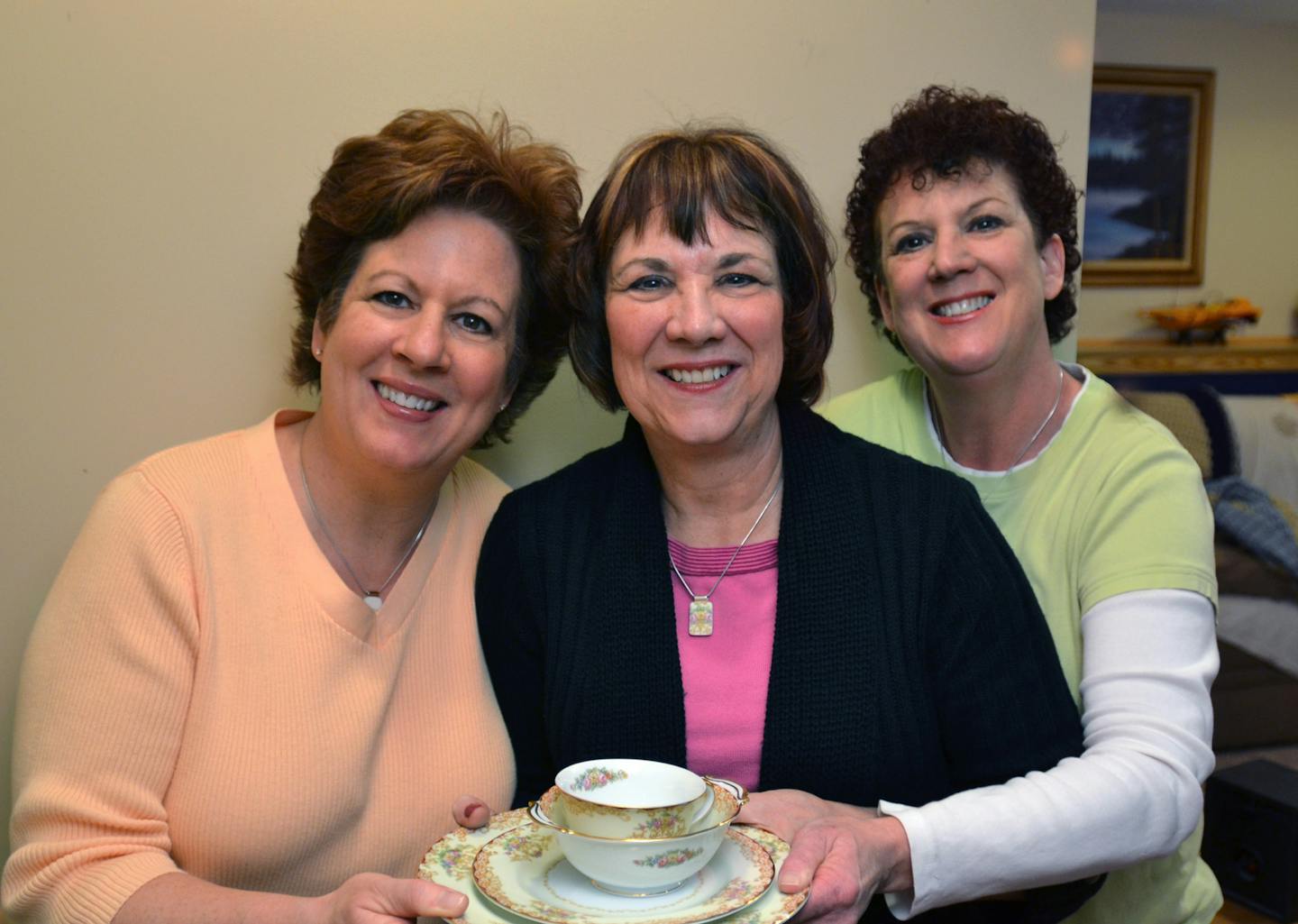 (Left to right) Sisters Mary Protas, Kathy Korsgaden and Suzie Nelson held pieces of their grandmother's china. ] Joey McLeister,Special to the Star Tribune,Coon Rapids,MN January 23,2013