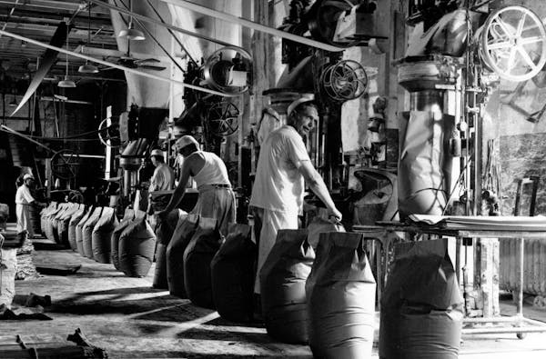 Workers fill sacks of flour at Pillsbury “A” Mill in the 1930s.