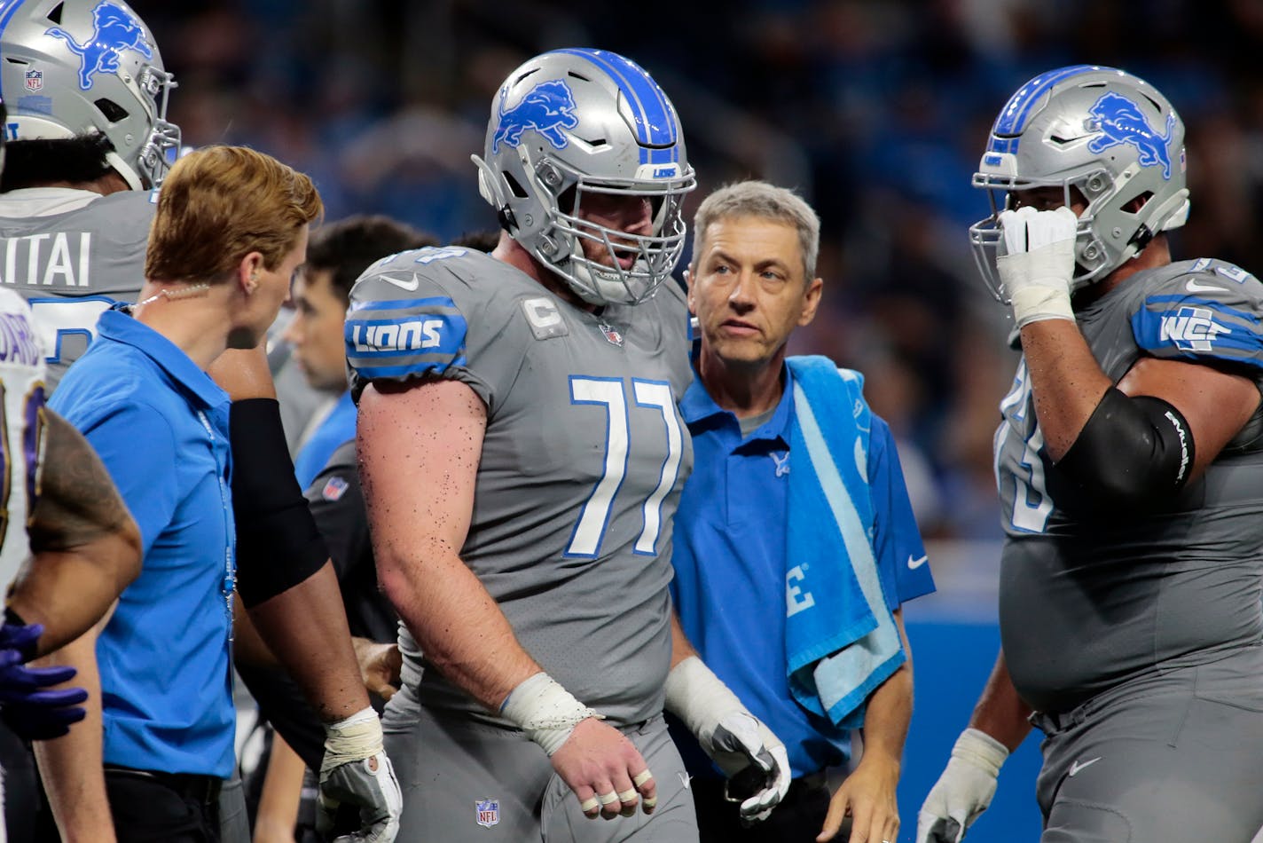 FILE - In this Sunday, Sept. 26, 2021, file photo, Detroit Lions center Frank Ragnow (77) walks to the sidelines after being injured in the second half of an NFL football game against the Baltimore Ravens in Detroit. Ragnow has a season-ending toe injury that requires surgery, a person familiar with the situation told The Associated Press on Tuesday, Oct. 12, 2021. The person spoke on condition of anonymity because the team had not provided an update on Ragnow's condition. (AP Photo/Tony Ding, File)