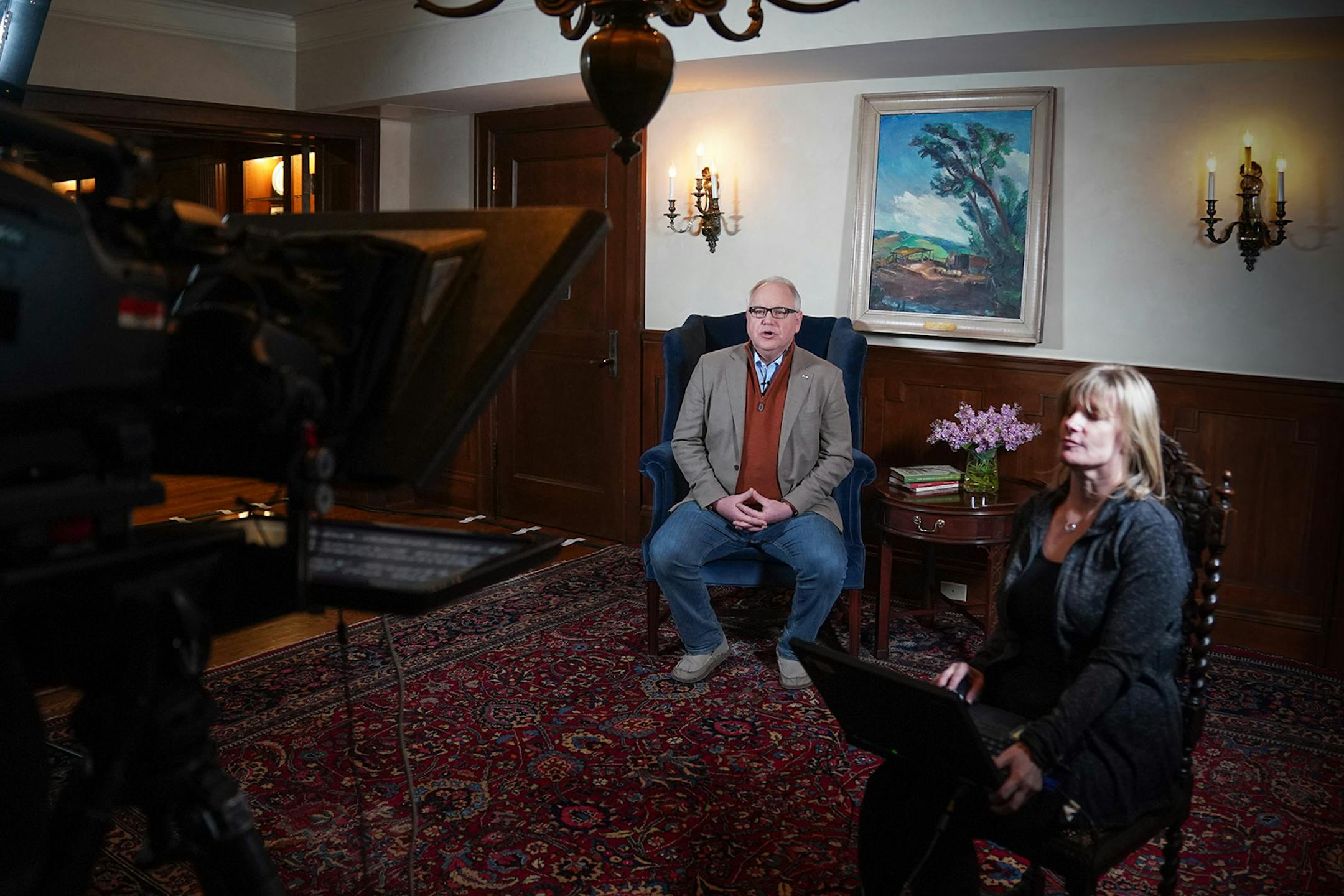 Minnesota Gov. Tim Walz prepared to deliver his State of the State address over YouTube from his residence. At right is prompter operator Laura Hammerbeck.
