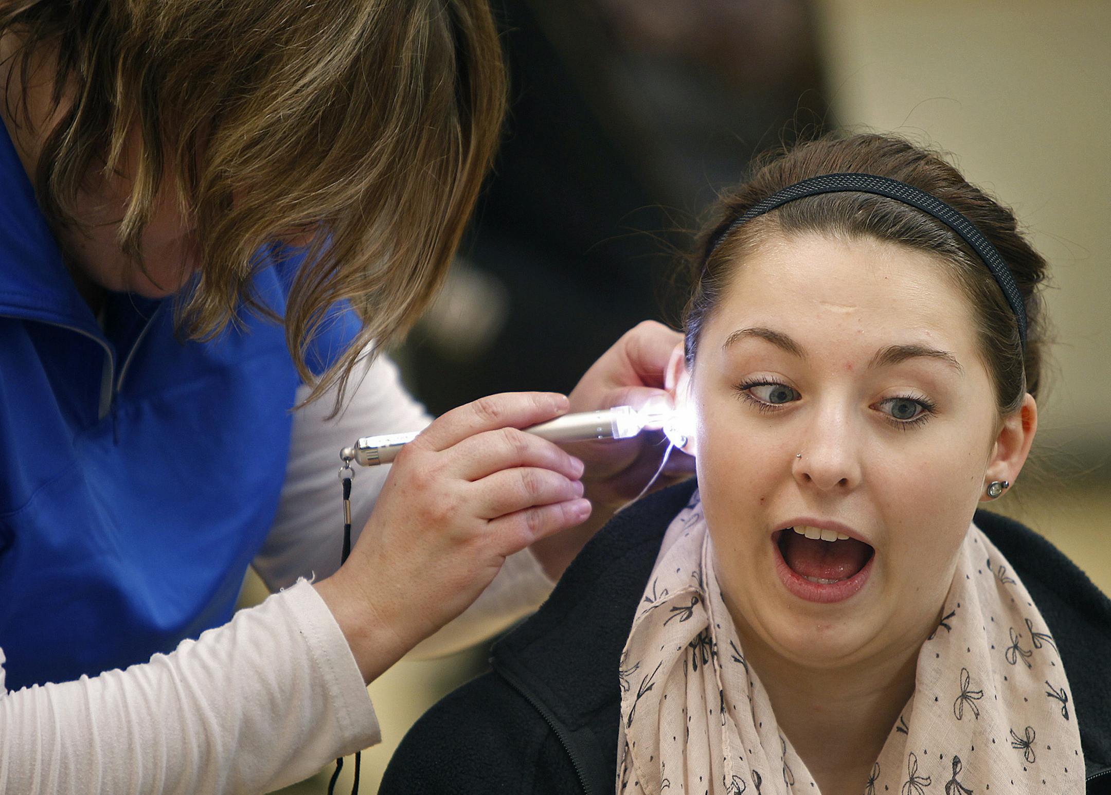 Liz Mushel, 17, cq, who plays the clarinet , joined hundreds of band members at Eagan High School that were fitted for custom made noise protection devices to combat the problems with hearing loss in teens, Wednesday, February 13, 2013 in Eagan, MN. (ELIZABETH FLORES/STAR TRIBUNE) ELIZABETH FLORES ¬• eflores@startribune.com ORG XMIT: MIN1302131551142128