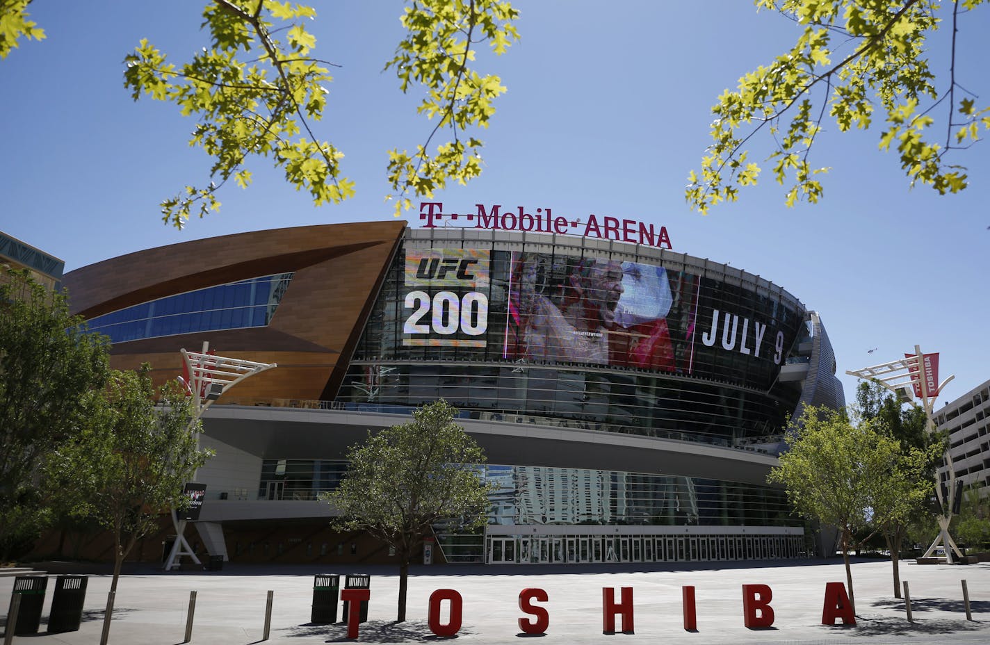 In this June 17, 2016 photo, an advertisement plays on a screen at the T-Mobile Arena in Las Vegas. A National Hockey League plan to expand to Las Vegas is being cheered by fans and backers of a years-long effort to get a pro sports franchise in Sin City, but hockey will have to elbow into a crowded entertainment lineup featuring casino games, celebrity shows, Cirque du Soleil productions and pulsing nightclubs &#xf1; not to mention boxing matches, UFC fights and events like the National Finals