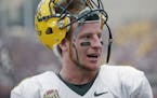 North Dakota State quarterback Carson Wentz (11) looks on from the sidelines during the fourth quarter of an NCAA college football game against Montan