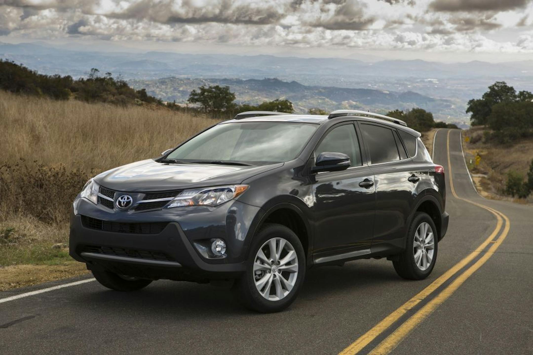 As part of the 2013 RAV4's makeover, Toyota tucked the exposed tire under the cargo floor and changed the rear gate to lift up, rather than out.
