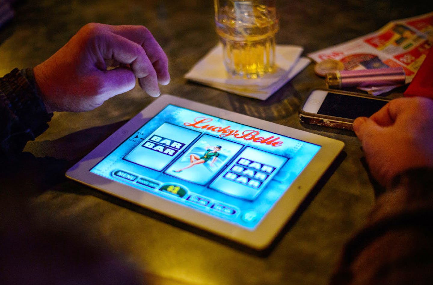 A bar patron played electronic pulltabs in Coon Rapids. Allied Charities of Minnesota, the trade group representing 1,200 nonprofits with charitable gambling operations, is asking lawmakers for tax relief.