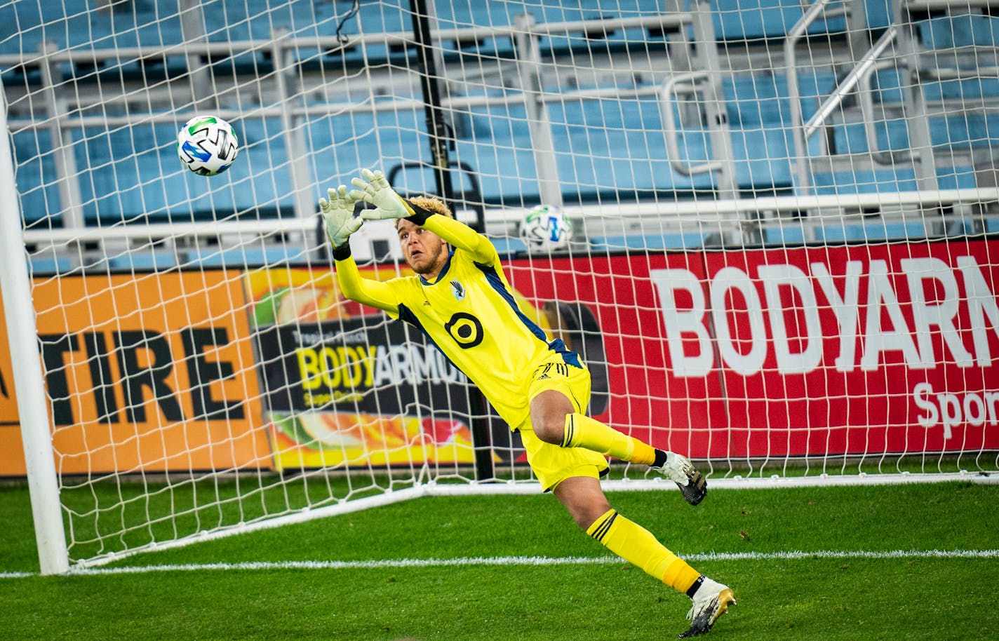 Minnesota United goalkeeper Dayne St. Clair (97) blocks a shot during the first half of an MLS match in St. Paul, Minn., Sunday, Oct. 18, 2020. (Leila Navidi/Star Tribune via AP)