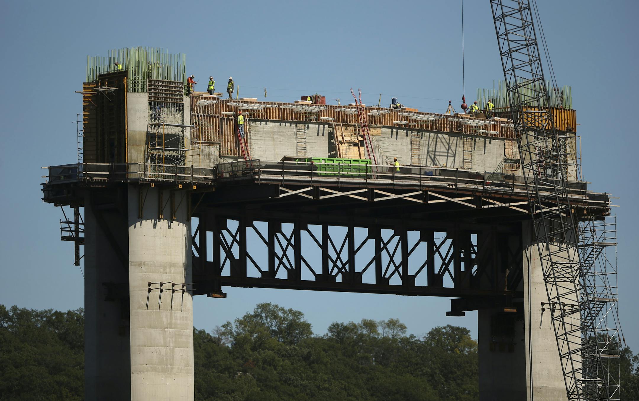 Workers atop pier 10 of the St. Croix Crossing project under construction Thursday afternoon on the St. Croix River near Stillwater. ] JEFF WHEELER • jeff.wheeler@startribune.com Problems with ironwork on the St. Croix River bridge were reported to project leaders months before last week's announcement of a major delay in the construction schedule. The St. Croix Crossing construction project was photographed Thursday afternoon, September 10, 2015 on the water of the St. Croix River.