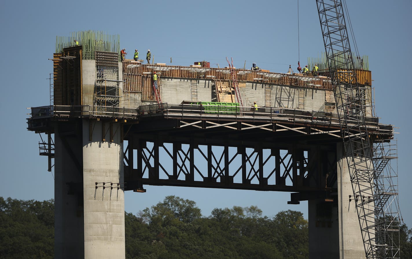 Workers atop pier 10 of the St. Croix Crossing project under construction Thursday afternoon on the St. Croix River near Stillwater. ] JEFF WHEELER &#x2022; jeff.wheeler@startribune.com Problems with ironwork on the St. Croix River bridge were reported to project leaders months before last week's announcement of a major delay in the construction schedule. The St. Croix Crossing construction project was photographed Thursday afternoon, September 10, 2015 on the water of the St. Croix River.