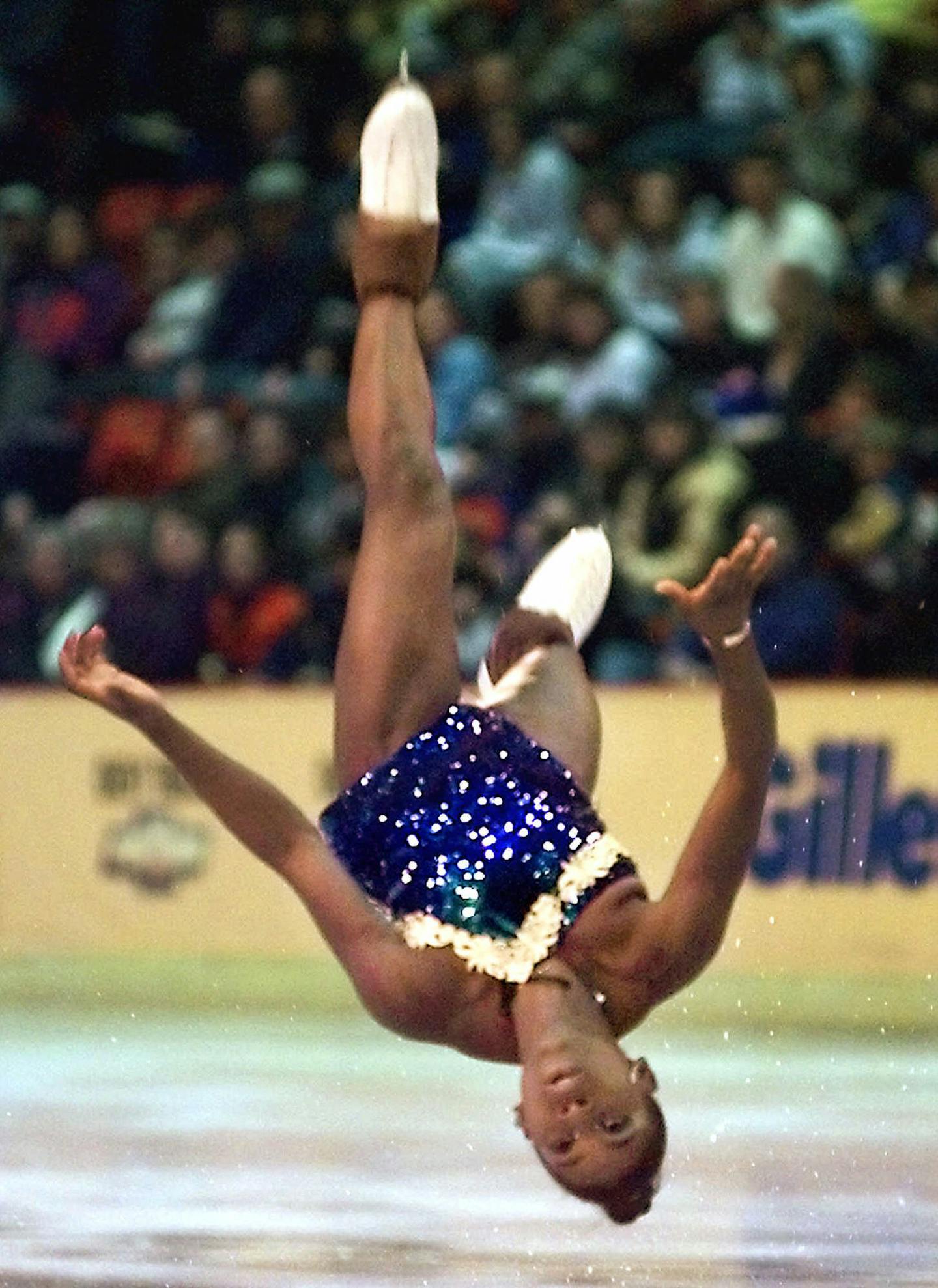 Surya Bonaly of France does a back flip during the ladies technical program at the Winter Goodwill Games on Friday, Feb. 18, 2000, in Lake Placid, N.Y. (AP Photo/Toby Talbot) ORG XMIT: XLP104